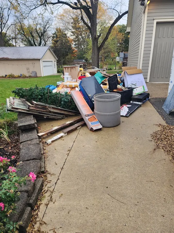 Dumpster being loaded with debris for Commercial Dumpster Rental in McKean
